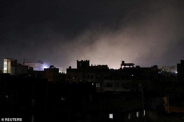 Dust rises from the site of strikes in Sanaa, Yemen, pictured on Saturday evening