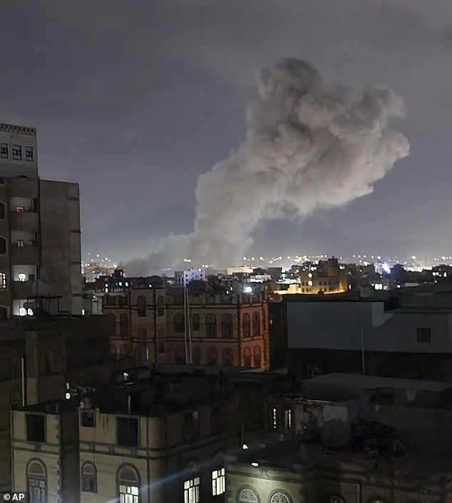 Smoke rises from a location reportedly struck by US airstrikes in Sanaa, Yemen on Saturday