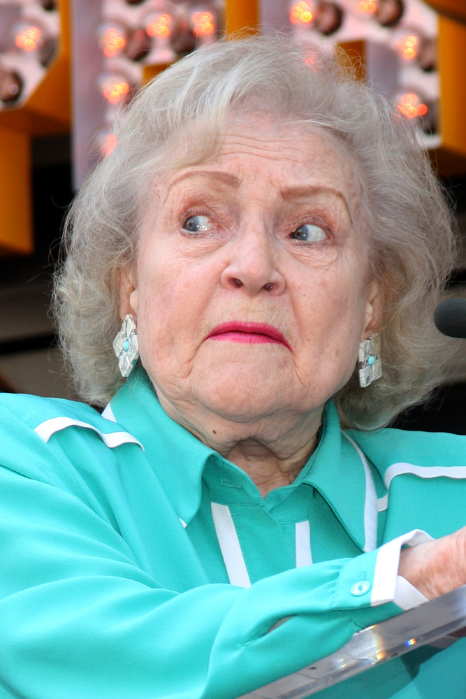 Betty White looks off camera with a concerned look on her face.